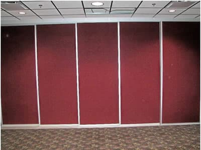 Sliding room dividers in a commercial installation